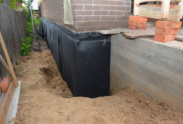 Happy homeowners after waterproofing job in Haven